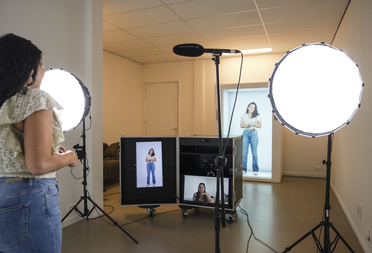 Girl recording in studio and transferring 3D images to holobox